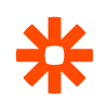 Logotipo Zapier que muestra una forma de estrella naranja compuesta por ocho flechas que apuntan hacia afuera.